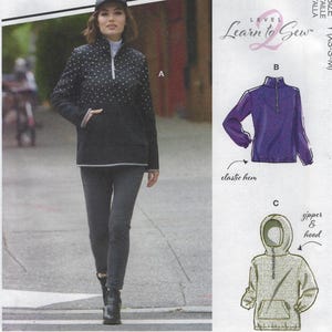 May include: A woman models a black and white polka dot pullover with a zipper and a black baseball cap. The image also shows illustrations of a purple pullover with an elastic hem and a hooded sweatshirt. The text "Learn 2 Sew" is visible.