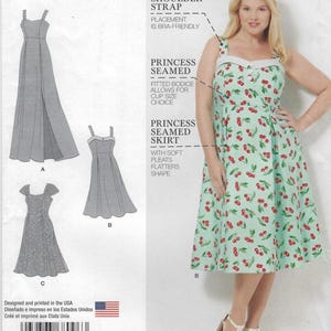 May include: An Amazing Fit sewing pattern envelope featuring a light green dress with a red cherry print, princess seams, and a white bodice trim. The pattern includes illustrations for three dress variations, labeled A, B, and C, with text.