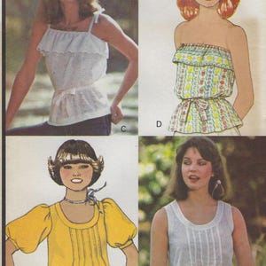 May include: A vintage sewing pattern featuring four different styles of tops. The tops are sleeveless, with a scoop neck, and have a gathered detail at the bust. The pattern is for sizes 6-14.