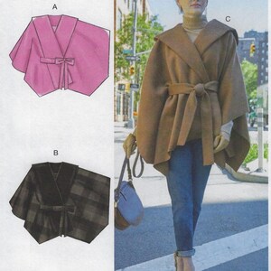 May include: A woman wearing a brown hooded cape with a matching belt, paired with blue jeans and leopard print heels. The image also shows illustrations of a pink cape and a black plaid cape.