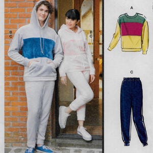 May include: A sewing pattern for a hooded sweatshirt and sweatpants set. The pattern includes a color-blocked sweatshirt with a blue and gray color scheme and a pair of gray sweatpants. The pattern also includes a separate pattern for a color-blocked sweatshirt with a pink and white color scheme and a pair of white sweatpants. The pattern also includes a separate pattern for a color-blocked sweatshirt with a green, pink, and yellow color scheme and a pair of blue sweatpants.