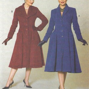 May include: Two knee-length coats with long sleeves, notched collars, and button-front closures. One coat is deep red, the other is royal blue. Both feature a flared skirt silhouette and are labeled A and B. Text at the bottom reads The Archive Collection Circa 1956.