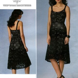 May include: A sewing pattern envelope for a Tracy Reese New York Vogue Patterns American Designer dress, labeled V1447. The image displays a black sleeveless dress with a square neckline and a grid-like lace overlay pattern over a light lining.