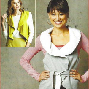 May include: A sewing pattern envelope titled KWIK Start Learn-to-Sew featuring two vest designs. Design A shows a lime green sleeveless vest over a white long-sleeve shirt. Design B shows a grey vest with a white collar and tie-waist belt.