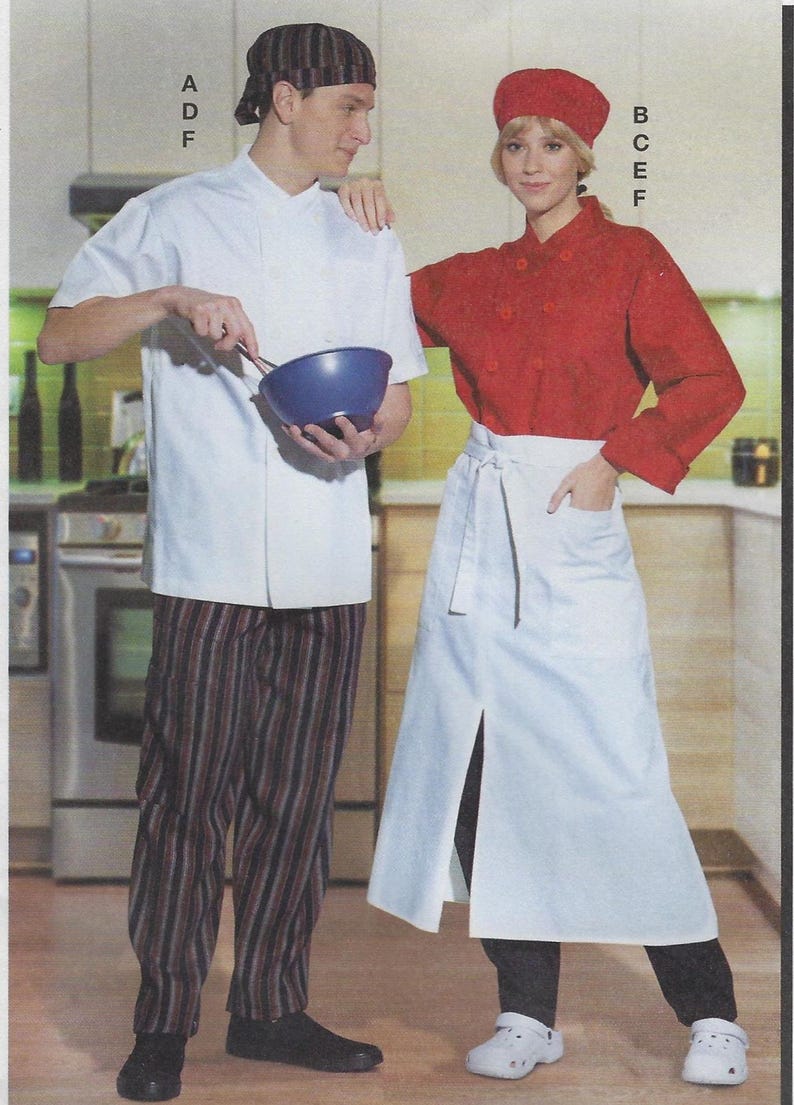 May include: Two chefs wearing white and red chef jackets with black and white striped pants and black pants. The chef on the left is holding a blue mixing bowl. The chef on the right is wearing a white apron with a black tie.