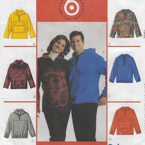 May include: A sewing pattern envelope titled PolarGear featuring six variations of long-sleeve pullovers. The designs include options with hoods, collars, front pockets, and various patterns like solid yellow, blue, orange, gray, and mountain prints.