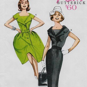 May include: Retro Butterick '60 vintage sewing pattern featuring two women in dresses. One dress is green with a flared skirt and the other is black with a pencil skirt. Both dresses have a button-down front and a belt.