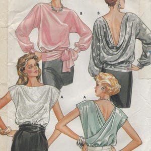 May include: A sewing pattern for a blouse with three different styles. The first style is a long-sleeved blouse with a bow tie. The second style is a short-sleeved blouse with a low back. The third style is a short-sleeved blouse with a draped back.