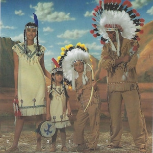 May include: A group of people wearing Native American-style costumes. The costumes include fringed dresses and pants, headdresses with feathers, and accessories like a bow and arrow and a drum. The background features a painted desert landscape.