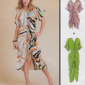 May include: A woman wearing a midi-length dress with a V-neck and short sleeves. The dress features a unique pattern with orange, black, and white abstract designs. The dress has a ruched center and a slit in the front. The image also shows two dress design illustrations.