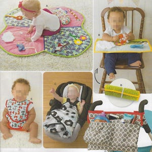 May include: A collection of baby items, including a play mat, high chair tray, car seat, bib, and stroller organizer. The play mat is pink and green with attached toys. The stroller organizer is gray with white circles.