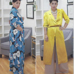 May include: A woman in two outfits: a blue floral print maxi dress and a yellow satin long coat with wide-leg pants. The dress features a blue background with white and blue flower patterns. The coat is belted at the waist.