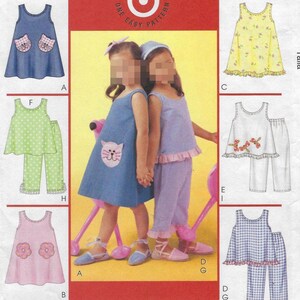 May include: A sewing pattern featuring children's clothing designs. The designs include dresses, tops, and pants in various colors and patterns, such as polka dots, floral prints, and gingham. The dresses have cat and flower appliqués.