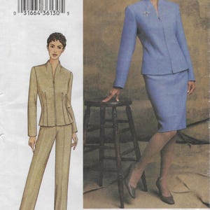May include: A Vogue Woman sewing pattern featuring two women modeling tailored suits. One suit is a light blue skirt suit, and the other is a tan pantsuit. The pattern number is 7682.