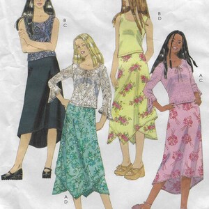 May include: A fashion illustration featuring four women modeling different outfits. The outfits include tops and skirts in various colors and patterns, such as floral and geometric designs. The image also includes text at the bottom indicating the pattern is for stretch knits.