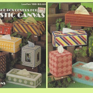 May include: A leaflet for plastic canvas tissue box covers. The leaflet shows 10 different designs for tissue box covers, including a design with a picture frame, a design with daisies, and a design with bamboo.