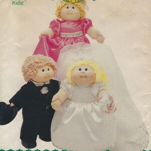 May include: Image of three Cabbage Patch Kids dolls. One doll wears a pink dress, another a wedding dress with a veil, and the third a black tuxedo. The dolls have blonde and light brown yarn hair and blue eyes. The text "Cabbage Patch Kids!" is at the top.