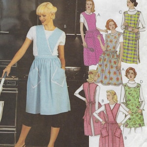 May include: The Retro collection image features a woman wearing a light blue and white gingham apron with pockets. The apron is paired with a white top and black capri pants. Other apron designs include floral, polka dot, and plaid patterns.