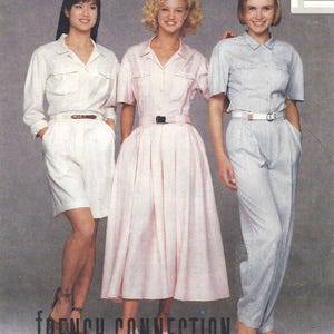 May include: Three outfits featuring collared shirts: a white long-sleeve shirt with matching shorts and a brown belt, a light pink short-sleeve button-down dress with a black belt, and a light blue short-sleeve shirt with matching trousers and a white belt.