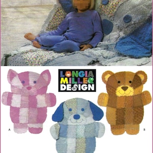 May include: A sewing pattern titled Longia Miller Design featuring instructions for three stuffed animal toys: a pink patchwork cat labeled A, a brown patchwork bear labeled B, and a blue patchwork dog labeled C, shown with a child on a quilt.