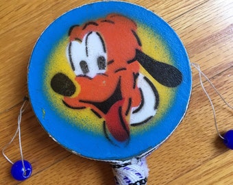 Pluto spin drum. Vintage, Disney, instrument toys, noisemaker, knockoff