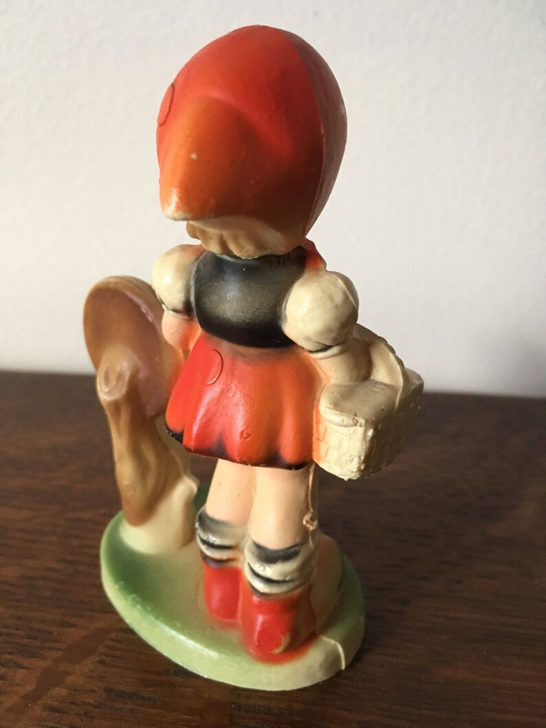Hummel girl at bus stop figurine. 1970s. Made in Hong Kong