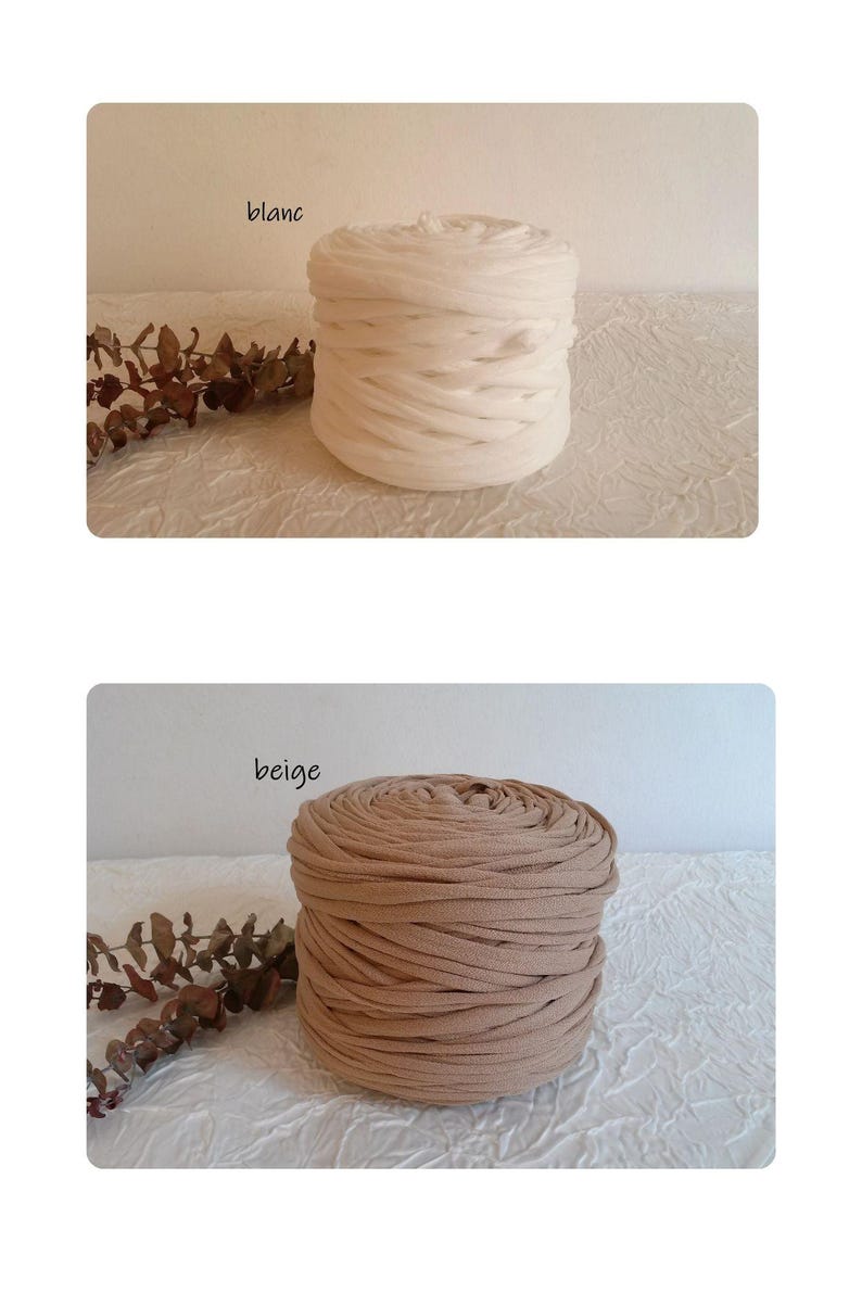 May include: Two spools of fabric, one white and one beige, are displayed. The white spool is labeled "blanc" and the beige spool is labeled "beige". The fabric is tightly wound, creating a cylindrical shape. The background is a textured white surface.