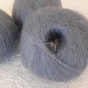 May include: Three skeins of soft, light gray yarn.