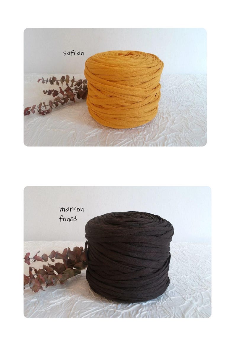 May include: Two spools of fabric yarn are displayed. One is a golden yellow color, labeled "safran". The other is a dark brown color, labeled "marron fonc&eacute;". Both spools are cylindrical and sit on a white textured surface.