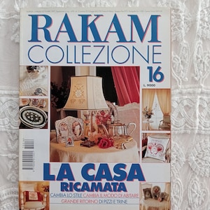 May include: A magazine cover featuring a white lampshade with gold embroidery, a red velvet curtain, and the text "LA CASA RICAMATA" in a decorative font. The magazine is titled "RAKAM COLLEZIONE 16" and features the tagline "CAMBIA LO STILE CAMBIA IL MODO DI ABITARE GRANDE RITORNO DI PIZZI E TRINE".