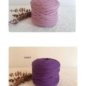 May include: Two spools of thick, soft fabric yarn in different shades of purple. The top spool is a muted rose color, labeled "vieux rose." The bottom spool is a deep violet, labeled "violet."