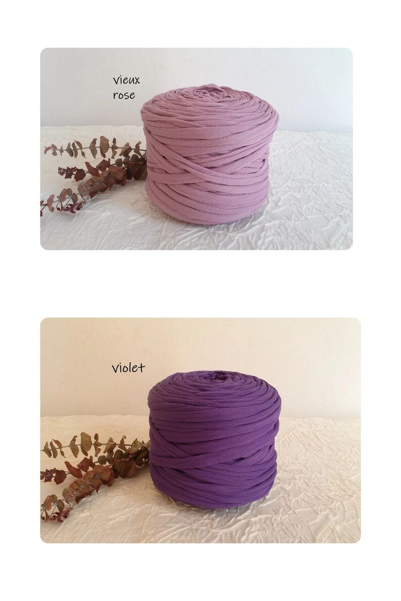 May include: Two spools of thick, soft fabric yarn in different shades of purple. The top spool is a muted rose color, labeled "vieux rose." The bottom spool is a deep violet, labeled "violet."
