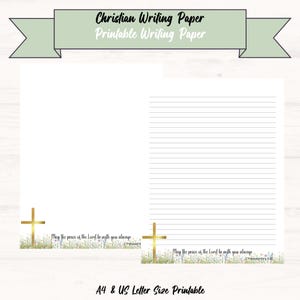 May include: White printable writing paper with lined pages, featuring a gold cross and floral accents. The text "Christian Writing Paper" and "Printable Writing Paper" is displayed at the top. The bottom of the page includes the text "May the peace of the Lord be with you always".