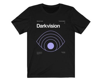 May include: Black t-shirt with a white graphic of an eye with concentric circles and the text "Darkvision" in white. The text "Second Level" and "Transmutation" are in smaller white text above and below the eye graphic.