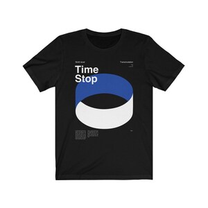 May include: Black t-shirt with a graphic design featuring the words "Time Stop" in white, above a blue and white abstract shape. The shirt also includes the text "Ninth level" and "Transmutation".