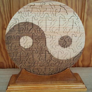 Jigsaw puzzle on base &quot;Ying-Yang in solid wood.