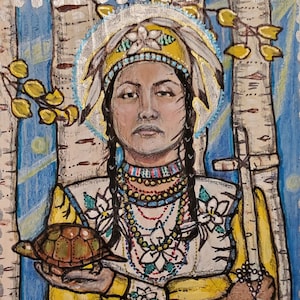 May include: A painting of a woman wearing a beaded headdress and a yellow dress. She is holding a turtle in her left hand and a rosary in her right hand. The painting is on a wooden background with birch trees and flowers. The text "St. Kateri Tekakwitha" is at the bottom of the painting.