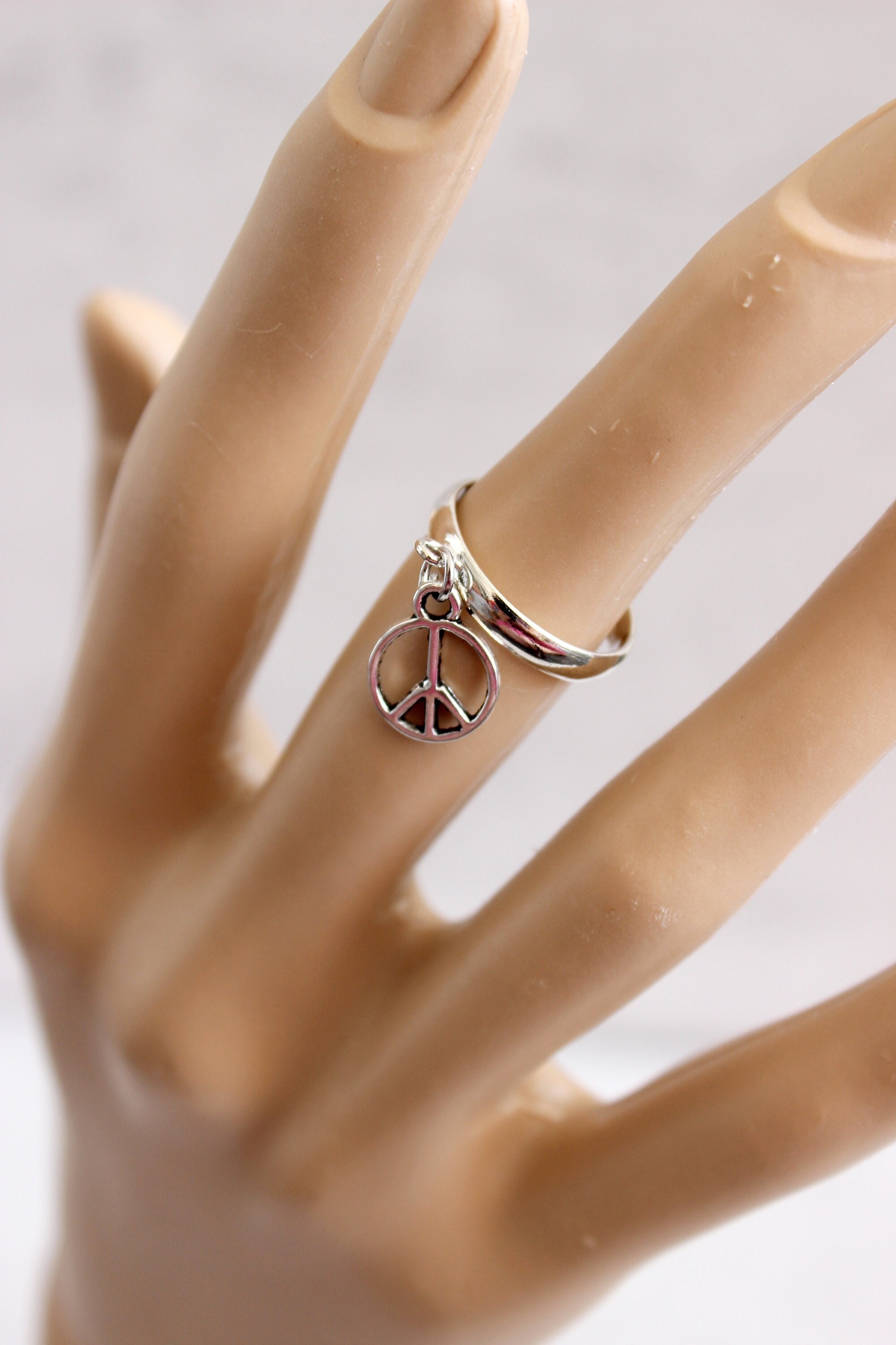 Silver tone charm ring. Adjustable ring for all sizes. Charm ring. Gift for her.  Women's ring. Pacifist sign ring. Dangle ring