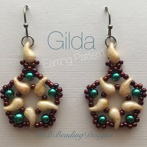 May include: Gilda Earring Pattern, a pair of earrings with a starburst design. The earrings are made with white, brown, and teal beads.