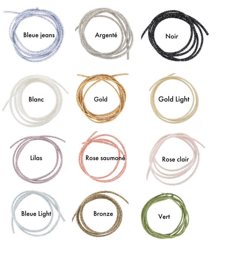 May include: Twelve spools of glitter cord in various colors, including blue jeans, silver, black, white, gold, light gold, lilac, salmon, light pink, light blue, bronze, and green.