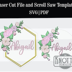 May include: A digital file for laser cutting or scroll saw cutting. The design features a hexagonal frame with a floral design and the name Abigail. The design is also available in a circular frame.