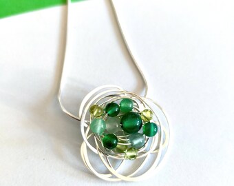Silver swirl green agate necklace.