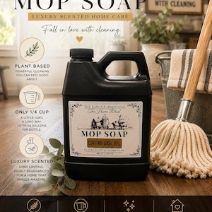 May include: A black plastic jug of The Fancy Farmhouse Mop Soap in Capri Soleil scent. The label features a farm illustration and text including 32 fl oz (946 ml). Surrounding text highlights plant-based ingredients and usage instructions.