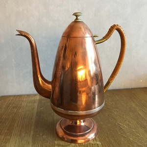 vintage jug made of thin copper plate.