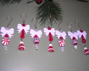 7 red and white Christmas ornaments, peppermint ornaments, Santa hat ornaments, white Christmas bow ornaments