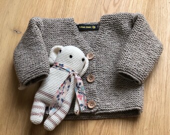 Hand knitted baby vest