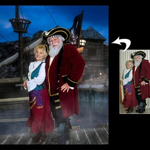 May include: A couple dressed as pirates, the woman in a red and teal dress and the man in a red coat with a black and white hat. They are standing in front of a ship and a wooden building.