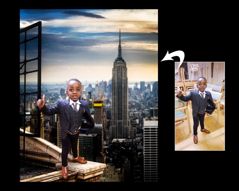 May include: A young boy in a dark gray suit and brown shoes stands on a rooftop with a cityscape background. The boy is giving a thumbs up and smiling. The Empire State Building is visible in the background.