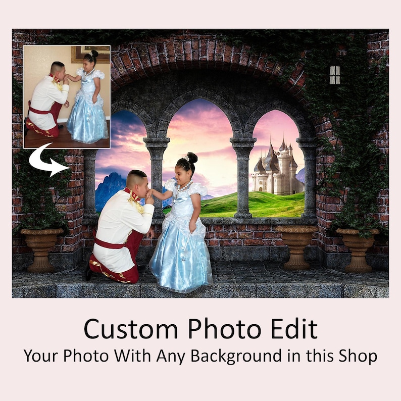May include: A photo editing service that allows you to add a fantasy castle background to your photo. The image shows a girl and a boy dressed as a princess and prince, standing in front of a brick archway with a view of a castle in the distance.