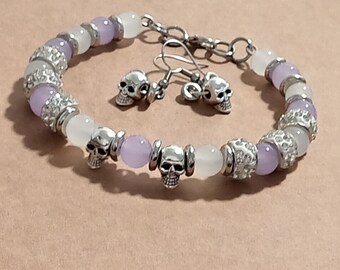 Conjunto de pulsera y pendientes de calavera